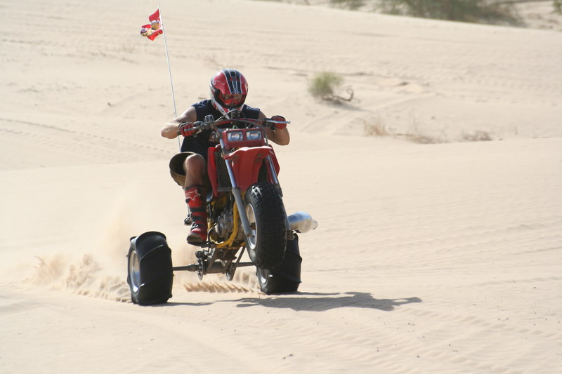 Glamis-1094 - Jim does a wheelie on his crazy 3-wheeler at Glamis.